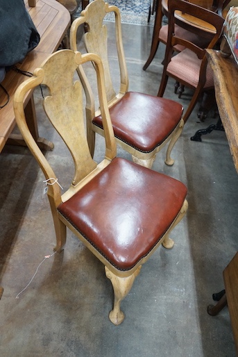 A set of four Queen Anne style pale walnut dining chairs with Merryweather plaques